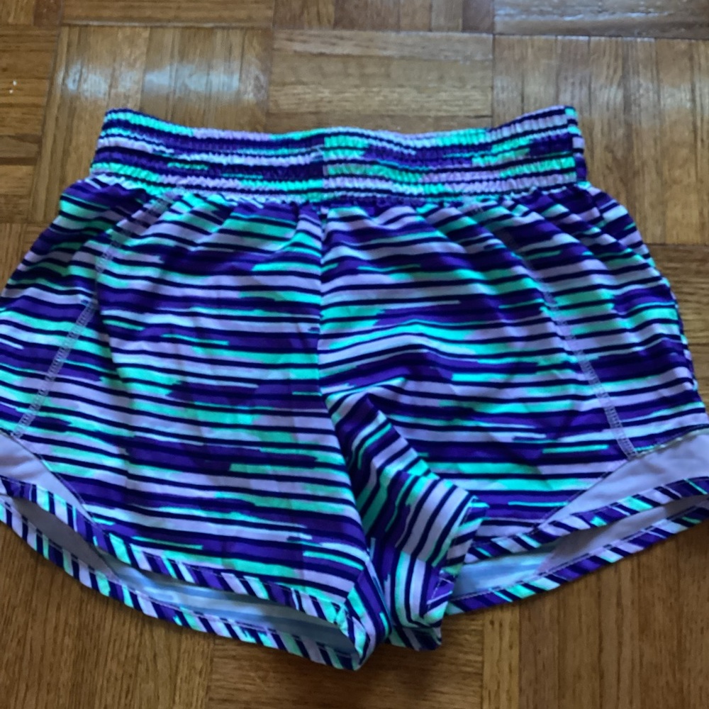 athletic purple and green shorts